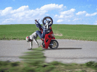 Motorcycle rides on man