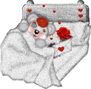 bear in bed with rose