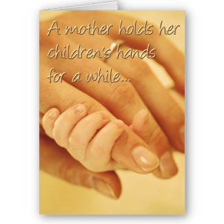 A mother holds her children's hands for a while...