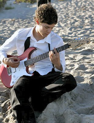 Adam Brody with guitar