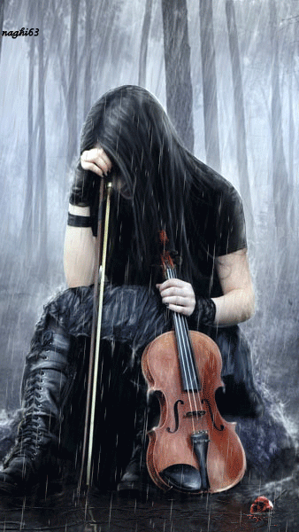 Sad girl with violin in the rain