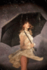 Sexy girl with umbrella in the rain