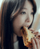 Girl eats pizza