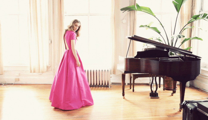 Girl wears pink dress -- Grand piano